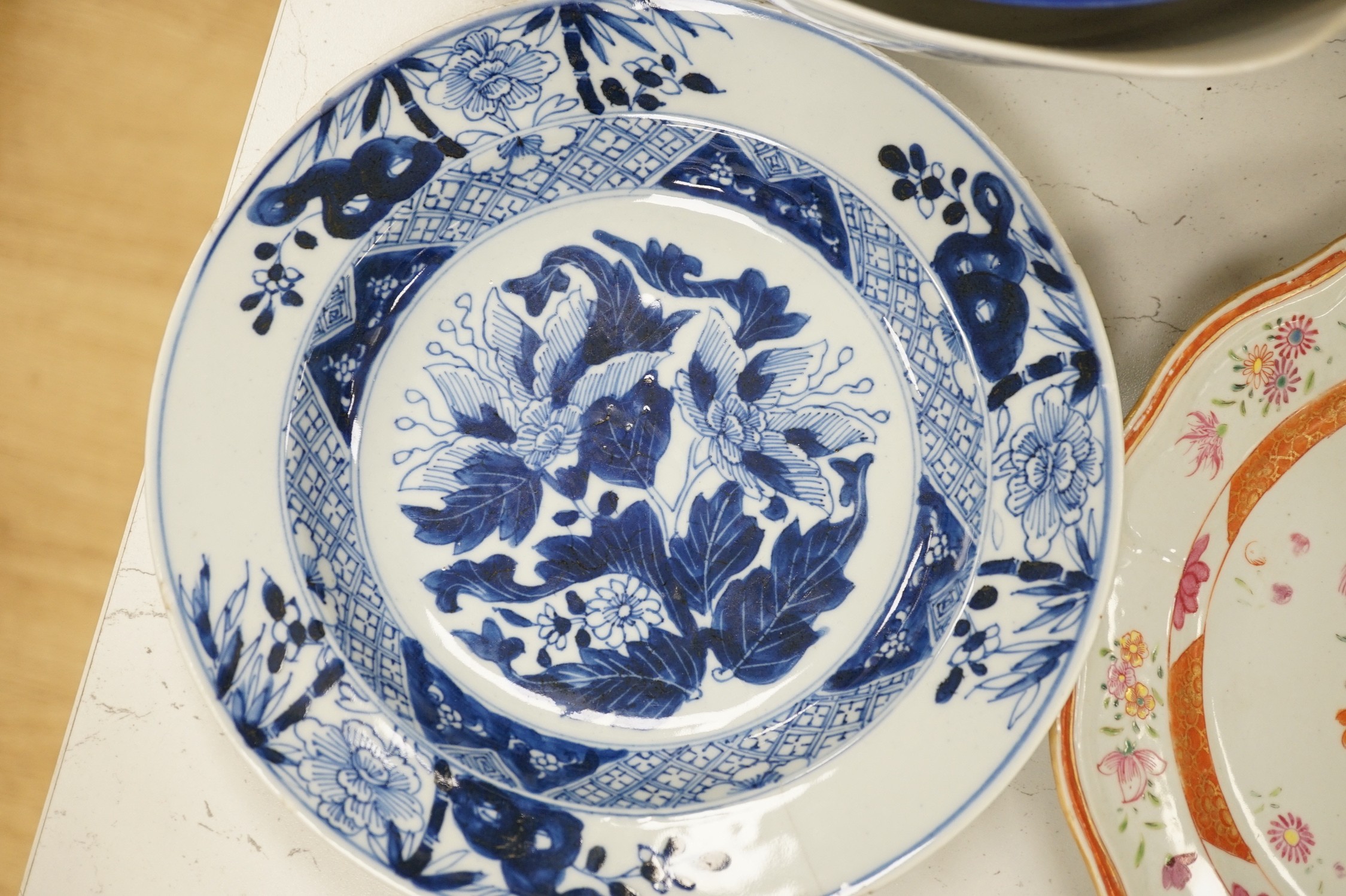 An assortment of Chinese porcelain tin-glazed earthenware charger and a Delft vase
